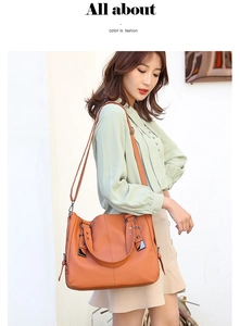 Outdoor lifestyle shot of a ginger orange PU leather shoulder bag on a model