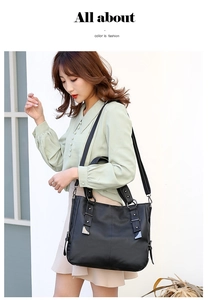 Outdoor model holding a black litchi pattern PU leather tote bag for casual commute