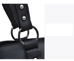 Detailed close-up of litchi grain leather strap with silver metal ring and rivets