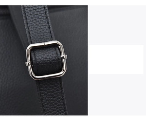 Detail of black lychee grain leather strap with silver square metal adjustment buckle