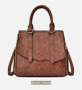 Front view of large brown tote bag with marble pattern leather and gold hardware
