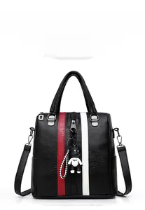 Front view of black leather backpack with red-white stripes and cute bear pendant charm