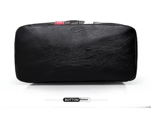 Detailed bottom view of black pebble leather handbag with premium reinforced stitching