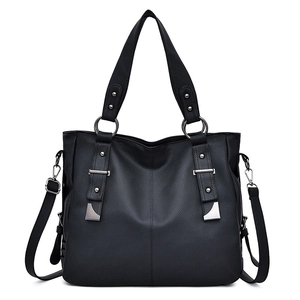 Elegant black lychee textured leather handbag with silver buckles and adjustable strap