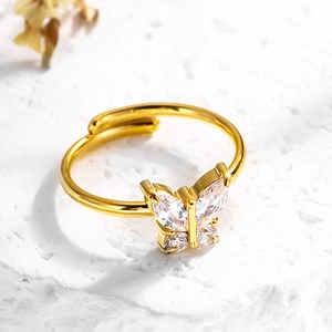 Anello aperto a farfalla in oro 18K con zirconi lucenti su base di pietra bianca