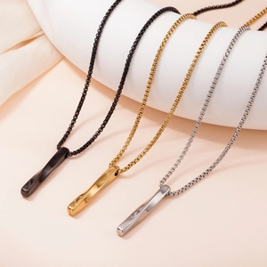Detailed view of spiral twisted bar pendants in black, gold, and silver finishes
