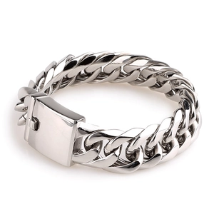 Macro shot of silver titanium steel double-weave Cuban chain link with polished clasp