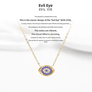 Macro shot of evil eye pendant featuring blue and white cubic zirconia on gold plated chain