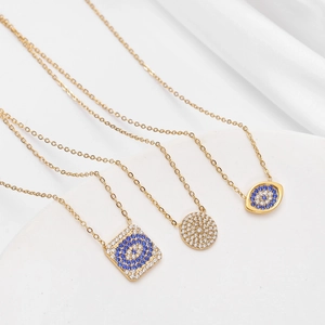 Gold evil eye necklaces with cubic zirconia in round, diamond, and marquise shapes