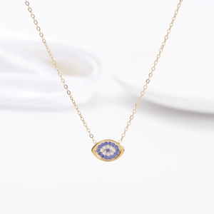 Gold Evil Eye necklace with blue and white zircon inlay on a minimalist chain
