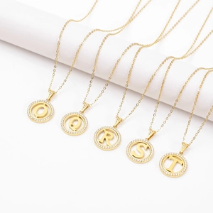 Gold hollow round alphabet necklaces with O-T letters and sparkling zircon crystals