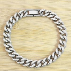Close-up of a silver stainless steel Cuban link bracelet with a rectangular clasp