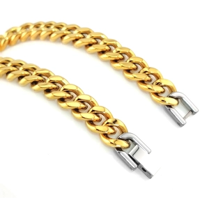 Polished gold and silver Cuban link bracelet with a secure stainless steel box clasp