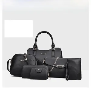 Detailed close-up of 6-piece black lychee pattern leather handbag set with gold hardware