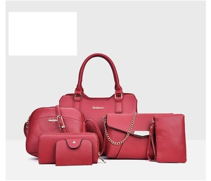 Detailed set of 6 red lychee pattern leather bags with golden hardware accents