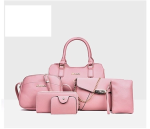 Detailed set of six pink lychee grain leather handbags with elegant gold metal hardware