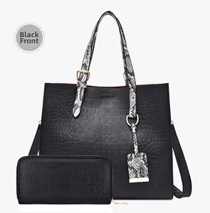 Front view of black tote bag and wallet set with crocodile and snake skin textures