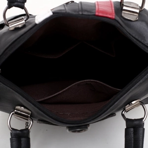 Top view of black leather handbag featuring red white stripes and multiple inner pockets