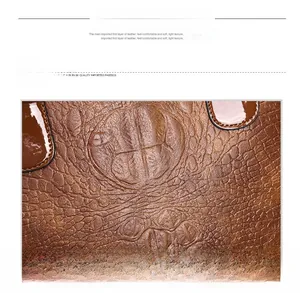 Detail of brown crocodile pattern leather showing soft texture and waterproof finish