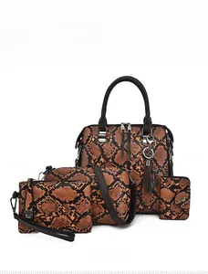 Detailed view of 4-piece brown snakeskin pattern handbag set including tote and wallet