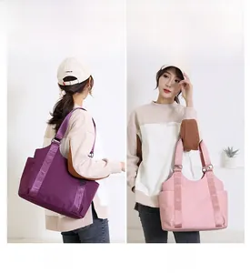 Detail of durable oxford tote bag showing shoulder and handheld carrying options