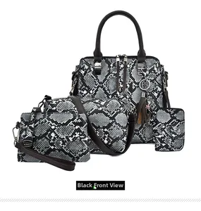 Macro detail of 4-piece black snakeskin tote bag set with silver zippers and tassel