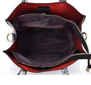 Top view of snake pattern tote bag interior showing spacious red compartments and zip divider