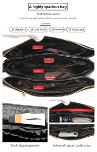 Detail view of the black embossed leather bag with multiple functional internal compartments