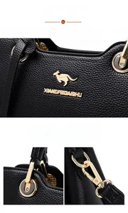 Details einer Handtasche aus Leder mit Litschistruktur, Känguru-Logo und Goldbeschlägen