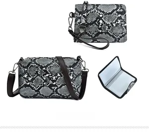 Detailed set of three snakeskin print bags including a crossbody, clutch and card holder
