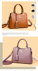 Detailansicht der genarbten Lederstruktur und Metallgriffe an braunen und lila Taschen