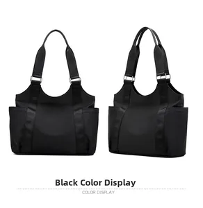 Front and side view of large black nylon tote bag with functional pockets and woven straps