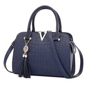Elegant navy blue crocodile embossed leather handbag with gold hardware and V-logo