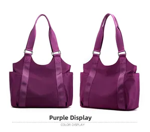 Detail view showing large purple oxford fabric tote bag with durable nylon texture