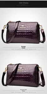 Detailed view of purple patent leather shoulder bag with crocodile texture and gold logo
