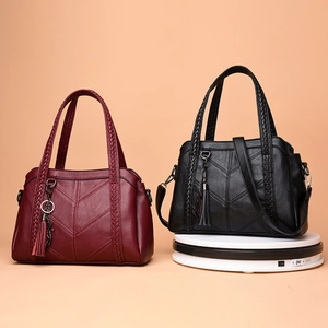 Women's minimalist soft leather tote bag with V-quilted stitching and braided handles