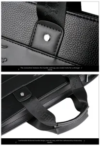 Detail of silver rivets and KANGAROO embroidered handle on black leather briefcase