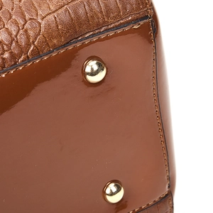 Brown crocodile embossed leather tote bag with glossy finish and gold rivet details