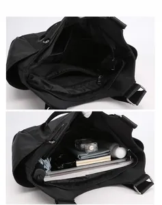 Detailed interior of a black oxford tote bag with multiple compartments for daily items