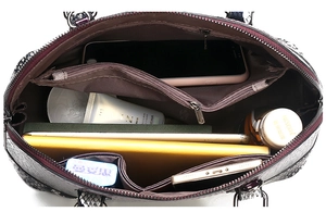Top-down view of crocodile pattern handbag showing large capacity and internal compartments