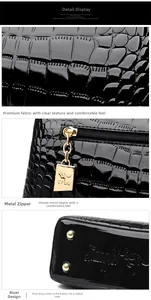 Detail of black faux crocodile leather with gold zipper puller and bottom rivets