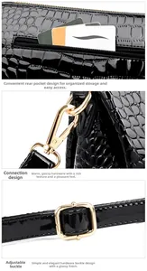 Close-up of black patent leather bag featuring golden hardware and adjustable strap buckle
