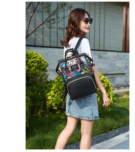 Outdoor lifestyle shot of a spacious backpack featuring tropical leaf prints and black panels