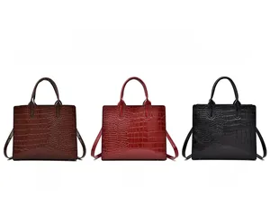 Crocodile pattern handbags shown in brown, red, and black with high-capacity design