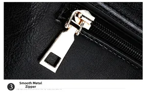 Détail de la fermeture éclair dorée lisse sur un sac en cuir texturé noir chic