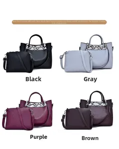 Detail view of 2-piece faux leather bag set with crocodile and snake skin textures