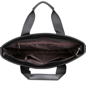 Internal view of business briefcase showing brown lining and storage pockets