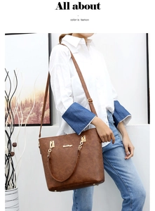Brown large capacity tote bag with gold chain handle and natural leather texture details
