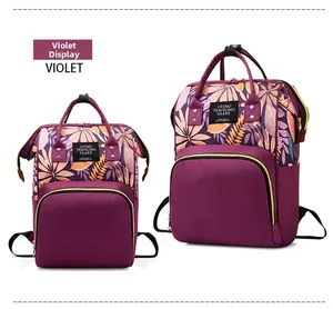 Detail of purple waterproof nylon backpack with tropical leaf pattern and top handle