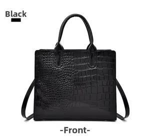 Front view of black crocodile pattern tote bag with polished finish and dual handles